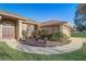 Charming home featuring a well manicured lawn with decorative shrubbery and a grand entrance at 10837 Versailles Blvd, Clermont, FL 34711