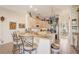 Open kitchen with granite countertops and stainless steel appliances at 10837 Versailles Blvd, Clermont, FL 34711