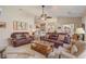 Spacious living room with ample seating, coffee table, and view to outside patio at 10837 Versailles Blvd, Clermont, FL 34711