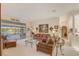 Relaxing living room with comfortable seating, neutral carpet and lots of natural light at 10837 Versailles Blvd, Clermont, FL 34711