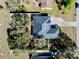 A charming home boasts a modern roof and sits on a well-manicured lot with lush landscaping at 3688 Hurlbut Cir, Lake Wales, FL 33898