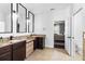 Bright bathroom with granite countertops, dark cabinets, and modern fixtures at 3688 Hurlbut Cir, Lake Wales, FL 33898