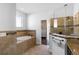 Bright bathroom featuring a soaking tub, glass enclosed shower, and neutral tiling at 3688 Hurlbut Cir, Lake Wales, FL 33898