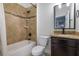 Cozy bathroom featuring tile shower, bathtub, and granite vanity at 3688 Hurlbut Cir, Lake Wales, FL 33898