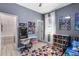 Bright bedroom featuring creative decor, colorful accents, and a gaming console at 3688 Hurlbut Cir, Lake Wales, FL 33898