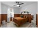 Cozy bedroom featuring stylish decor, neutral carpet, and natural light at 3688 Hurlbut Cir, Lake Wales, FL 33898