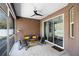 Inviting screened patio with cozy seating, string lights, fan, and sliding glass door, perfect for outdoor enjoyment at 3688 Hurlbut Cir, Lake Wales, FL 33898