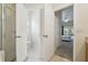 Bathroom featuring shower and toilet rooms adjacent to a bedroom entrance at 4002 Bougainvillea Pl, Kissimmee, FL 34746
