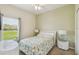 Relaxing bedroom features neutral walls, carpet and a bright window at 4002 Bougainvillea Pl, Kissimmee, FL 34746