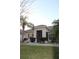Inviting entryway with a screened porch and well-maintained landscaping and a tile roof at 4002 Bougainvillea Pl, Kissimmee, FL 34746