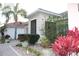 Close up of entryway with attractive shrubbery and a tile roof at 4002 Bougainvillea Pl, Kissimmee, FL 34746