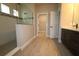 Modern bathroom featuring tiled floors, glass shower, and an adjacent closet at 16906 Cedar Valley Cir, Clermont, FL 34711