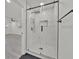 Modern bathroom featuring a frameless shower with sleek fixtures and designer tile work at 2415 Sutton Rd, Lakeland, FL 33810