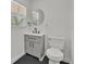 Bathroom features a modern sink, black hardware and a built in mirror at 2415 Sutton Rd, Lakeland, FL 33810