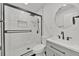 Bright bathroom with a modern sink, black hardware and beautifully tiled walk-in shower at 2415 Sutton Rd, Lakeland, FL 33810