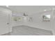 Spacious bedroom with a ceiling fan and multiple windows letting in lots of natural light at 2415 Sutton Rd, Lakeland, FL 33810