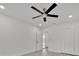 This bedroom includes a ceiling fan, closet, and easy access to the hall at 2415 Sutton Rd, Lakeland, FL 33810