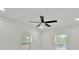 Bright bedroom featuring a modern ceiling fan and a window bringing in plenty of natural light at 2415 Sutton Rd, Lakeland, FL 33810