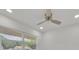 Bedroom with a modern ceiling fan and natural light coming through the large window at 2415 Sutton Rd, Lakeland, FL 33810