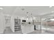 Bright kitchen featuring white cabinets, stainless steel appliances, and a quartz countertop island at 2415 Sutton Rd, Lakeland, FL 33810