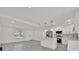 Updated kitchen featuring stainless steel appliances and an island with quartz countertops at 2415 Sutton Rd, Lakeland, FL 33810