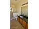 Bathroom featuring tile flooring, a glass shower, and vanity with granite countertop at 447 Wildflower Rd, Davenport, FL 33837