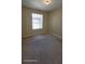 Bedroom featuring neutral walls, standard window, and wall-to-wall carpeting at 447 Wildflower Rd, Davenport, FL 33837