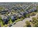 Neighborhood aerial view showcases a home with classic architecture in a well-kept neighborhood at 9170 Tavistock Lakes Blvd, Orlando, FL 32827