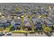 An aerial view of a home in a residential neighborhood, highlighted with a yellow border at 9170 Tavistock Lakes Blvd, Orlando, FL 32827