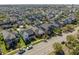 Picturesque aerial view of a suburban neighborhood featuring neat rows of homes at 9170 Tavistock Lakes Blvd, Orlando, FL 32827