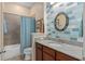 Well-maintained bathroom featuring modern fixtures and stylish blue tile accents at 9170 Tavistock Lakes Blvd, Orlando, FL 32827