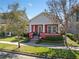 Charming single-story home with a welcoming front porch and well-maintained landscaping at 9170 Tavistock Lakes Blvd, Orlando, FL 32827