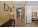 Spacious hallway with archway, stylish flooring, and decorative lighting at 9170 Tavistock Lakes Blvd, Orlando, FL 32827