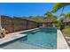 Swimming pool with stone patio at 9170 Tavistock Lakes Blvd, Orlando, FL 32827