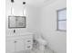 Bright bathroom featuring a vanity, toilet, mirror, and window at 1508 Leighton Ave, Lakeland, FL 33803