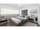 Bedroom featuring a bed, two nightstands, and a large window with natural light at 1508 Leighton Ave, Lakeland, FL 33803