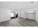 Bright bedroom with wood floors, a glass sliding door to the patio, and closet at 1508 Leighton Ave, Lakeland, FL 33803