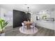 Stylish dining area adjacent to a modern kitchen, perfect for entertaining at 1508 Leighton Ave, Lakeland, FL 33803