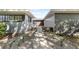 Charming front entrance with gray exterior, manicured landscaping, and a decorative gate at 1508 Leighton Ave, Lakeland, FL 33803