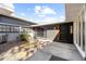 Stylish front entrance showcasing gray exterior, decorative plants, and modern black door at 1508 Leighton Ave, Lakeland, FL 33803