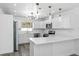 Bright kitchen with modern appliances, white cabinetry, and countertop seating at 1508 Leighton Ave, Lakeland, FL 33803