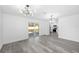 Bright living area with sliding doors to backyard and modern lighting fixtures at 1508 Leighton Ave, Lakeland, FL 33803