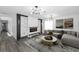 Bright living room featuring a fireplace and elegant decor at 1508 Leighton Ave, Lakeland, FL 33803