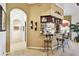 Stylish bar area with seating and adjacent to the kitchen and living spaces at 252 Bayou Bend Rd, Groveland, FL 34736