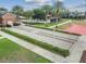 Image showcases a bocce ball court with well-maintained landscaping and a nearby recreation area at 252 Bayou Bend Rd, Groveland, FL 34736