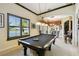 Game room with a pool table and a view of the lake at 252 Bayou Bend Rd, Groveland, FL 34736