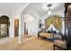 Elegant living room featuring arched doorways, carpet flooring, and sophisticated decor at 252 Bayou Bend Rd, Groveland, FL 34736