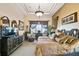 Tastefully decorated main bedroom with a sitting area and ample natural light at 252 Bayou Bend Rd, Groveland, FL 34736