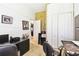 Well-lit office space featuring white and gold-colored walls, closet space, and carpeted floors at 252 Bayou Bend Rd, Groveland, FL 34736