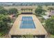 Aerial view of a community tennis court, showcasing the layout and surrounding greenery at 252 Bayou Bend Rd, Groveland, FL 34736